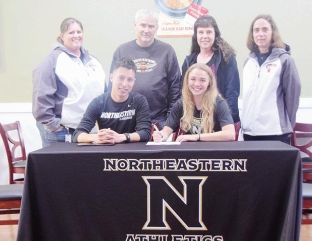 Jaycie Dillenburg (right front) pictured with coach Ken McAlpine (left front), (back row) coach Kristen Hamil, parents Rick and Linda and coach Paula Etl. (Kyle Inman / Sterling Journal-Advocate)