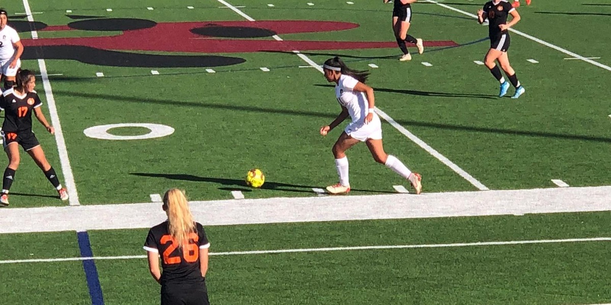 Sophomore Emali Ortega pushes the ball up field during the Plainswomen's match against Central Wyoming.